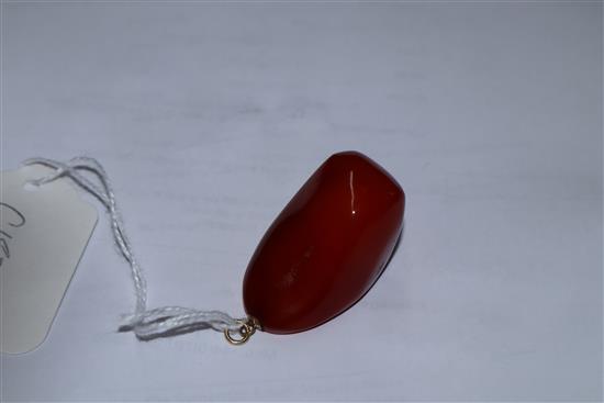 A yellow metal mounted natural amber pebble pendant, with GCS certificate dated 8/5/19.